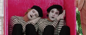 Movie still from “Starsky & Hutch” (2004), directed by Todd Phillips – Two mimes laying on the ground with their hands behind their heads; Medium shot, Overhead angle