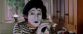 Movie still from “Starsky & Hutch” (2004), directed by Todd Phillips – Mime talking on the phone while wearing gloves; Close Up shot, Over the shoulder angle