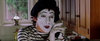 Movie still from “Starsky & Hutch” (2004), directed by Todd Phillips – Mime talking on the phone while wearing gloves and a hat; Close Up shot, Over the shoulder angle
