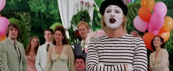 Movie still from “Starsky & Hutch” (2004), directed by Todd Phillips – Mime with white face and black striped shirt standing in front of other mimes; Close Up shot, Over the shoulder angle