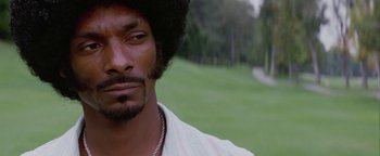 Movie still from “Starsky & Hutch” (2004), directed by Todd Phillips – A person with a beard; Close Up shot, Over the shoulder angle