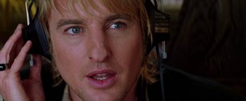Movie still from “Starsky & Hutch” (2004), directed by Todd Phillips – A person wearing headphones; Close Up shot, Low angle