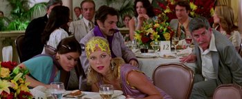 Movie still from “Starsky & Hutch” (2004), directed by Todd Phillips – A man and a woman sitting at a dinner table; Medium shot, Over the shoulder angle