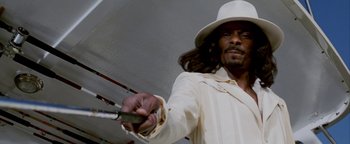 Movie still from “Starsky & Hutch” (2004), directed by Todd Phillips – A man in a white hat holding a fishing pole; Close Up shot, Low angle