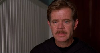Movie still from “State and Main” (2000), directed by David Mamet – A person with a mustache; Close Up shot, Over the shoulder angle
