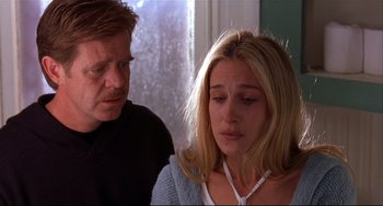 Movie still from “State and Main” (2000), directed by David Mamet – A man and a woman sitting next to each other in front of a window; Close Up shot, Over the shoulder angle