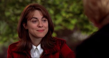 Movie still from “State and Main” (2000), directed by David Mamet – A person wearing a red jacket; Close Up shot, Over the shoulder angle