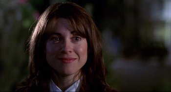 Movie still from “State and Main” (2000), directed by David Mamet – A person with long brown hair; Close Up shot, Over the shoulder angle