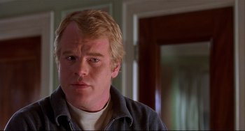 Movie still from “State and Main” (2000), directed by David Mamet – A person wearing a jacket; Close Up shot, Low angle