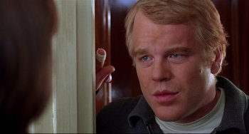 Movie still from “State and Main” (2000), directed by David Mamet – A man's face as he looks at the camera; Close Up shot, Low angle