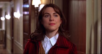 Movie still from “State and Main” (2000), directed by David Mamet – A person wearing a jacket; Close Up shot, Over the shoulder angle