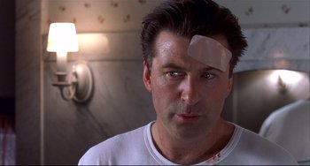 Movie still from “State and Main” (2000), directed by David Mamet – A man with bandages on his head and a patch on his forehead; Close Up shot, Low angle