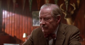 Movie still from “State and Main” (2000), directed by David Mamet – An older man wearing a suit and a bow tie; Close Up shot, Low angle