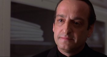 Movie still from “State and Main” (2000), directed by David Mamet – A person wearing a black shirt; Close Up shot, Low angle