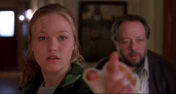 Movie still from “State and Main” (2000), directed by David Mamet – A young girl and an older man are playing a video game; Close Up shot, Low angle