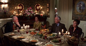 Movie still from “State and Main” (2000), directed by David Mamet – Two people sitting at a table with a turkey; Medium shot, Over the shoulder angle