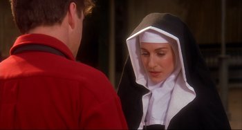 Movie still from “State and Main” (2000), directed by David Mamet – A woman wearing a nun's habit talking to a man; Close Up shot, Over the shoulder angle