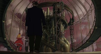 Movie still from “Steamboy” (2004), directed by Shinji Takagi – A man standing in front of an industrial machine; Wide shot, Low angle