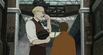 Movie still from “Steamboy” (2004), directed by Shinji Takagi – A man standing next to another man in a train station; Medium shot, Over the shoulder angle