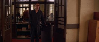 Movie still from “Step Up” (2006), directed by Anne Fletcher – A man standing in front of a trash can; Wide shot, Low angle