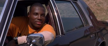 Movie still from “Step Up” (2006), directed by Anne Fletcher – A man sitting in the driver's seat of a car; Close Up shot, Low angle