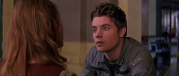 Movie still from “Step Up” (2006), directed by Anne Fletcher – A young man sitting in front of a woman; Close Up shot, Over the shoulder angle