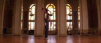 Movie still from “Step Up” (2006), directed by Anne Fletcher – A man and a woman performing a dance in a large room; Wide shot, Low angle