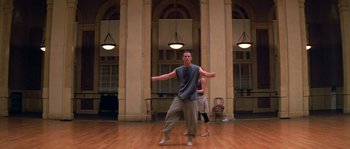 Movie still from “Step Up” (2006), directed by Anne Fletcher – A man and a woman are dancing in a room; Wide shot, Low angle