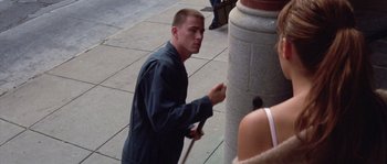 Movie still from “Step Up” (2006), directed by Anne Fletcher – A man with a cane standing next to a pillar; Medium shot, High angle