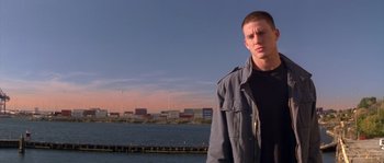 Movie still from “Step Up” (2006), directed by Anne Fletcher – A man standing in front of a body of water; Medium shot, Low angle