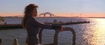 Movie still from “Step Up” (2006), directed by Anne Fletcher – A woman standing next to a body of water; Wide shot, High angle