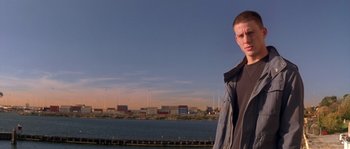 Movie still from “Step Up” (2006), directed by Anne Fletcher – A man standing in front of a body of water; Medium shot, Low angle