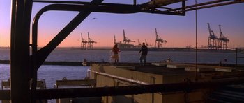 Movie still from “Step Up” (2006), directed by Anne Fletcher – Two people standing on a dock looking at the ocean; Extreme Wide shot, High angle