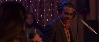 Movie still from “Step Up” (2006), directed by Anne Fletcher – A young man wearing headphones and a microphone; Close Up shot, Over the shoulder angle