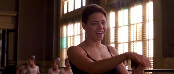 Movie still from “Step Up” (2006), directed by Anne Fletcher – A beautiful young lady standing in front of a group of people; Close Up shot, Over the shoulder angle