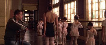 Movie still from “Step Up” (2006), directed by Anne Fletcher – A group of young ballerinas standing in a row in front of a window; Medium shot, Over the shoulder angle