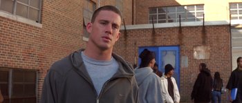 Movie still from “Step Up” (2006), directed by Anne Fletcher – A person standing in front of a group of people; Close Up shot, Over the shoulder angle