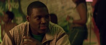Movie still from “Step Up” (2006), directed by Anne Fletcher – A young man is smiling for the camera; Close Up shot, Over the shoulder angle