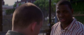 Movie still from “Step Up” (2006), directed by Anne Fletcher – Two young boys talking to each other in a park setting; Close Up shot, Over the shoulder angle