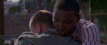 Movie still from “Step Up” (2006), directed by Anne Fletcher – A man holding a child in his arms; Close Up shot, Over the shoulder angle