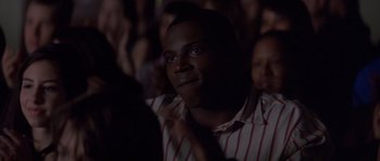 Movie still from “Step Up” (2006), directed by Anne Fletcher – A person wearing a striped shirt; Close Up shot, Over the shoulder angle