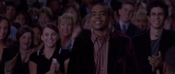 Movie still from “Step Up” (2006), directed by Anne Fletcher – A group of people sitting in a room; Medium shot, High angle