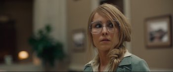 Movie still from “Stockholm” (2018), directed by Robert Budreau – A woman wearing glasses looking up at the sky; Close Up shot, Over the shoulder angle
