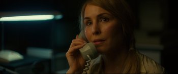 Movie still from “Stockholm” (2018), directed by Robert Budreau – A woman holding a phone up to her ear; Close Up shot, Low angle