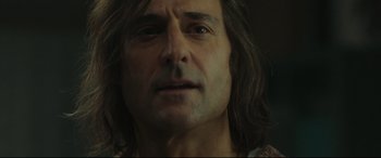 Movie still from “Stockholm” (2018), directed by Robert Budreau – A man with long hair; Close Up shot, Low angle