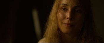 Movie still from “Stockholm” (2018), directed by Robert Budreau – A woman's face with long blonde hair; Close Up shot, Over the shoulder angle