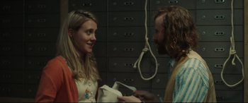 Movie still from “Stockholm” (2018), directed by Robert Budreau – A man and a woman are talking to each other; Close Up shot, Over the shoulder angle