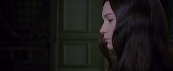 Movie still from “Stoker” (2013), directed by Park Chan-wook – A person with long black hair; Close Up shot, Over the shoulder angle