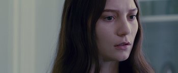 Movie still from “Stoker” (2013), directed by Park Chan-wook – A woman's face with long brown hair; Close Up shot, Over the shoulder angle