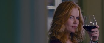 Movie still from “Stoker” (2013), directed by Park Chan-wook – A person with long red hair; Close Up shot, Over the shoulder angle